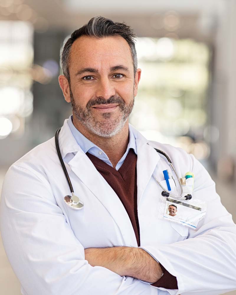 DoctorPrePro Male doctor wearing stethoscope at his practice.