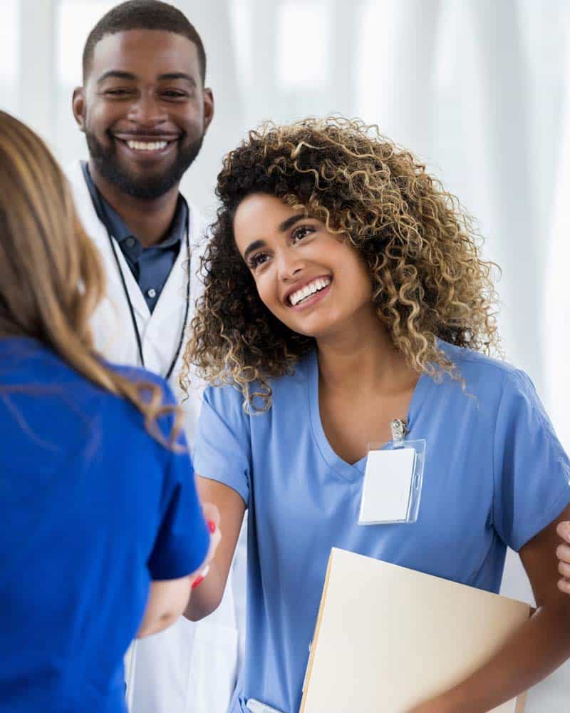 A Physicians Assistant shakes hands with a patient