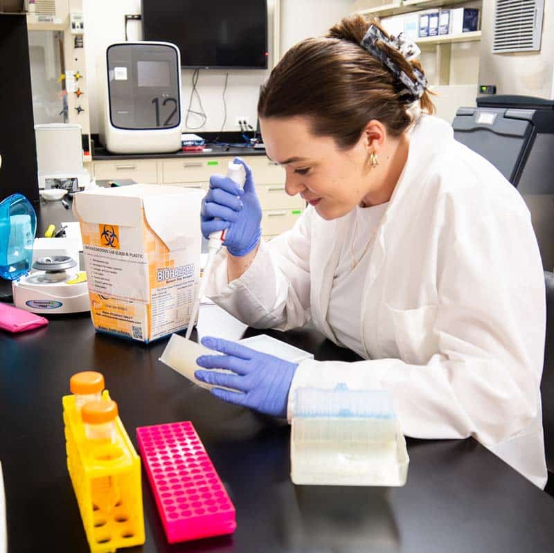 A female student working in the PGx lab pursuing a Pre- Professional Degree now in her graduate work.