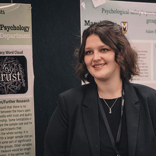 At the student research symposium, a student presents.