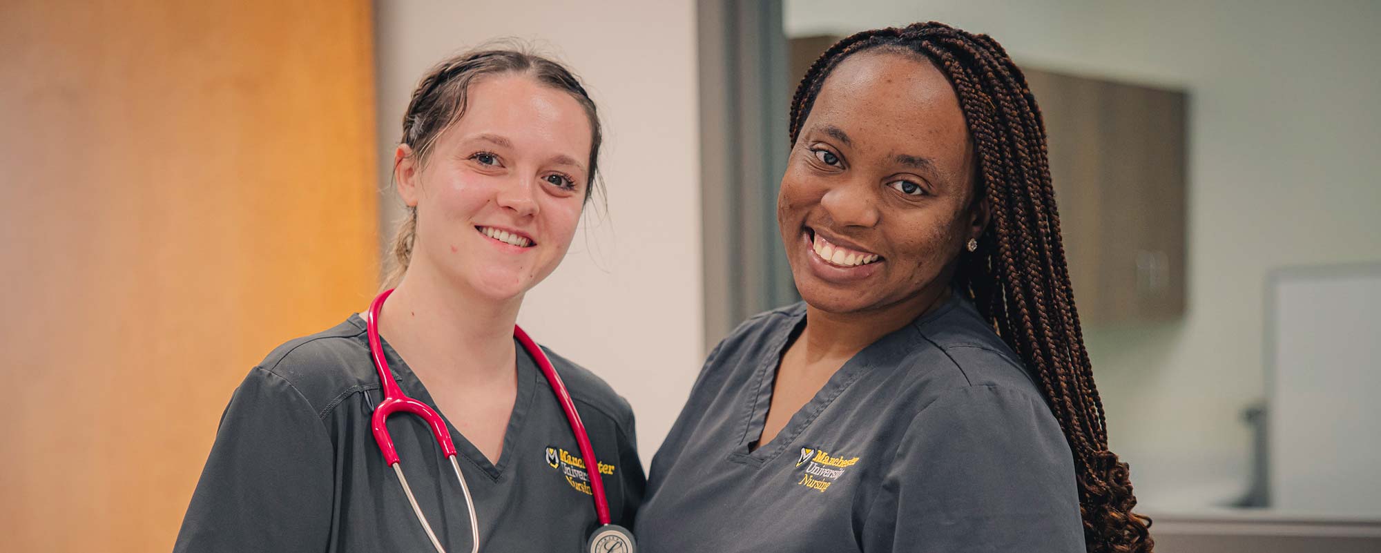 NurseHeader 2 nurses pose together