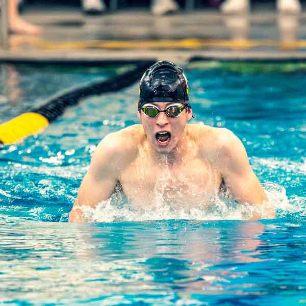 SwimmerWR A male swimmer in the pool comes up for a breath between strokes.